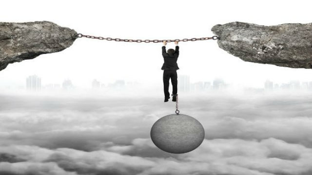 tax burden ball and chain